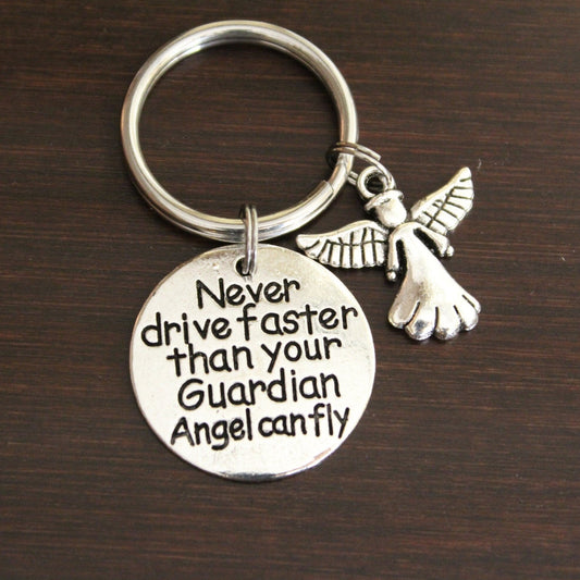 never drive faster than your guardian angel can fly with angel charm keychain