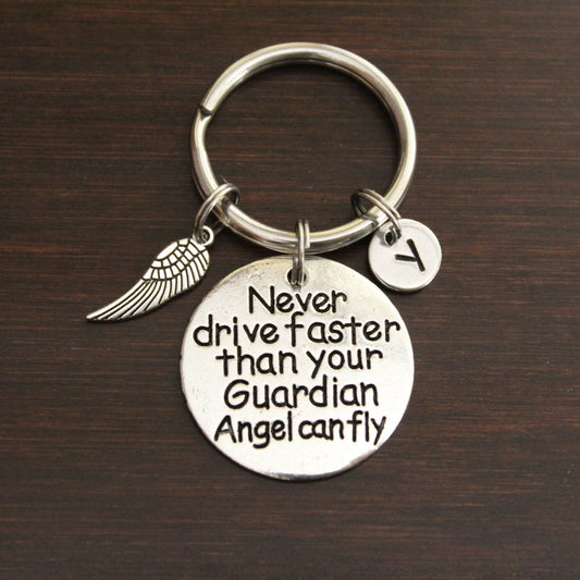 never drive faster than your guardian angel can fly keychain with wing