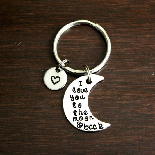 moon shaped keychain with I love you to the moon and back saying